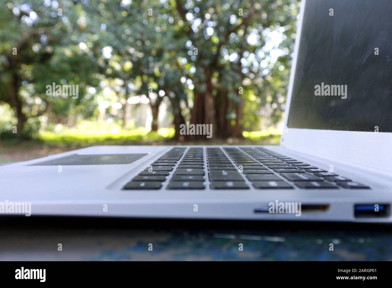 Photo of laptop computer at an outdoor park Stock Photo - Alamy