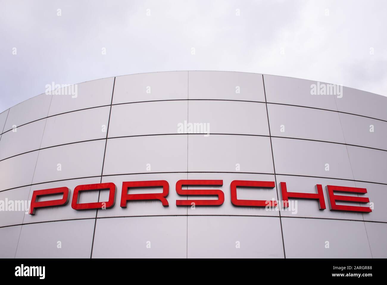 RIGA, LATVIA. 22nd January 2020. Porsche company logo on Porsche centre Riga. Porsche is a German automobile manufacturer specializing in high-performance sports cars, SUVs and sedans. Stock Photo