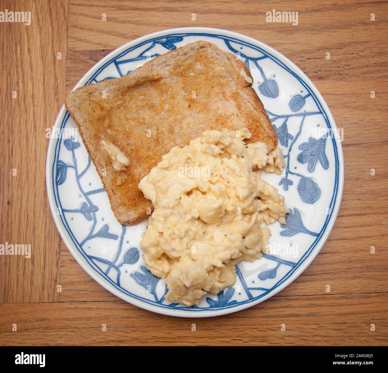 Scrambled eggs on toast Stock Photo