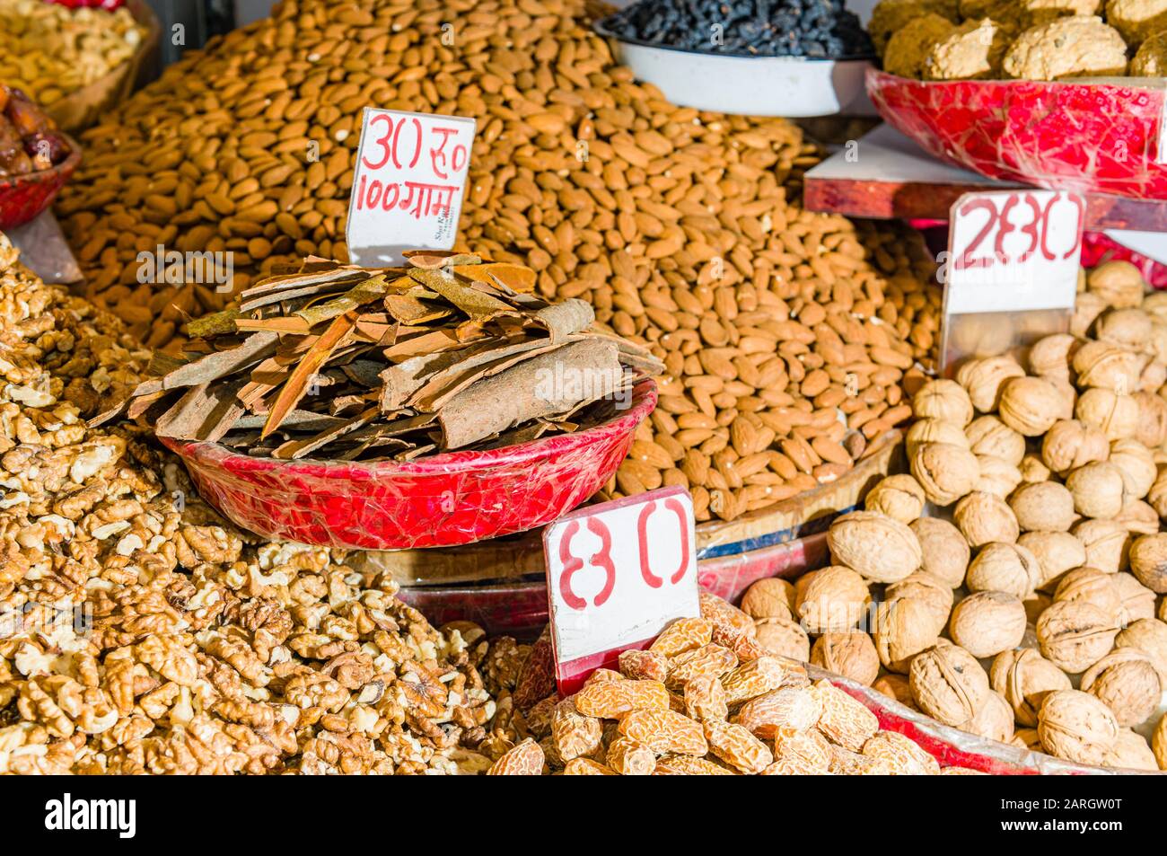 Nuts and many different spices are for sale in the spice market in Old Delhi Stock Photo