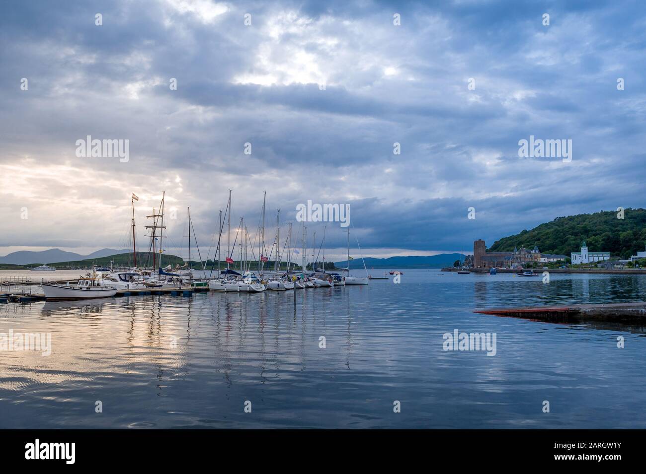 Oban marina after sunset panoramic view of sailing boats docked. Hebrides islands, Scotland. Stock Photo