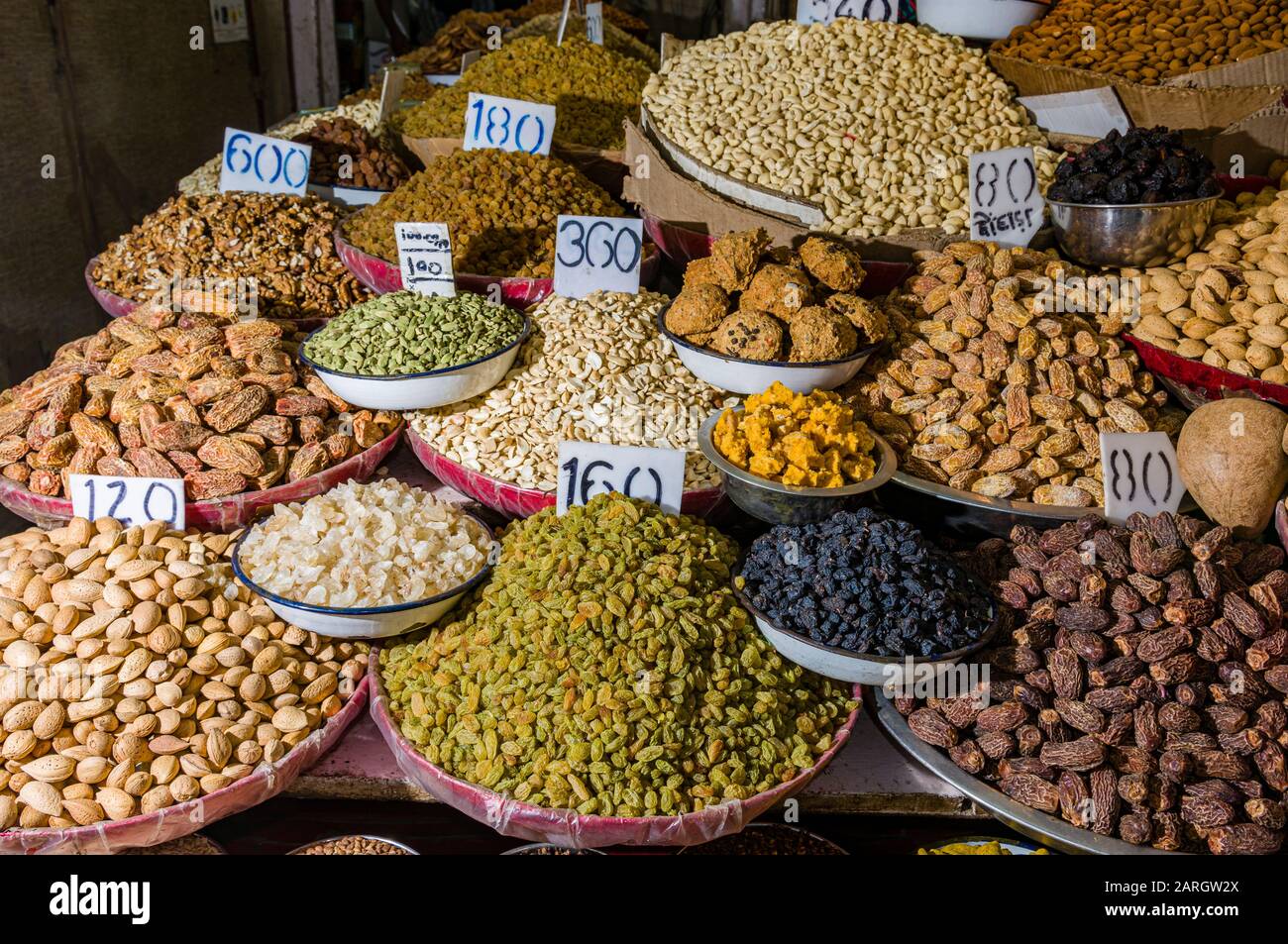 Nuts and many different spices are for sale in the spice market in Old Delhi Stock Photo