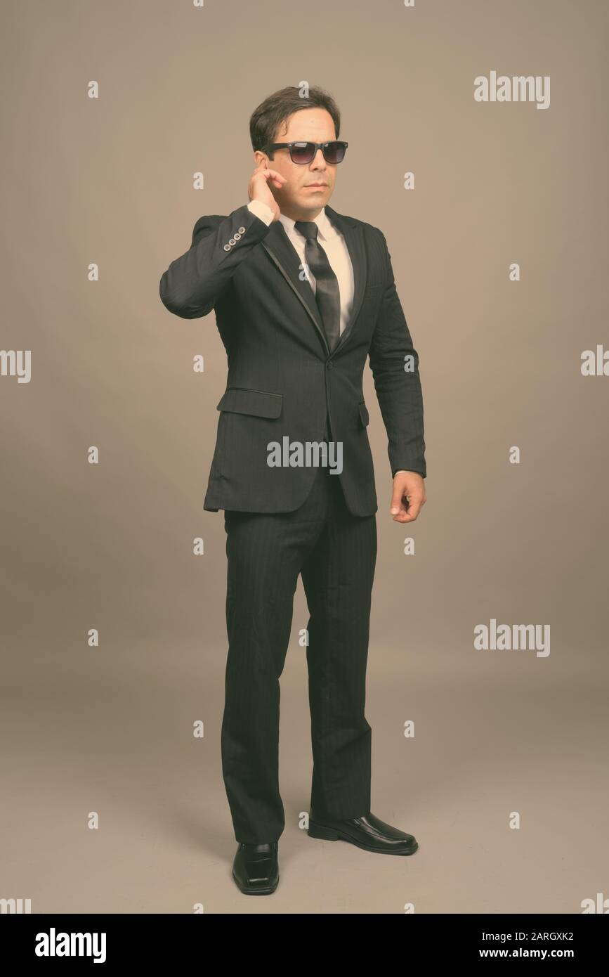 Portrait of handsome Persian businessman in suit Stock Photo