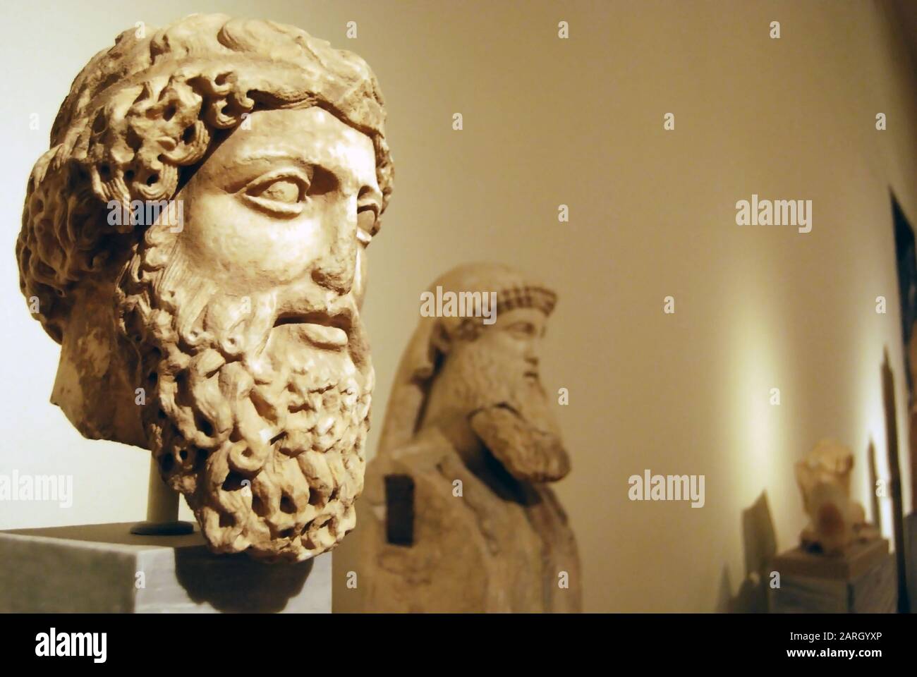 Athens 12/01/2019 Male head and bust, two bearded men with curly hair, ancient greek sculptures in museum, selective focus Stock Photo