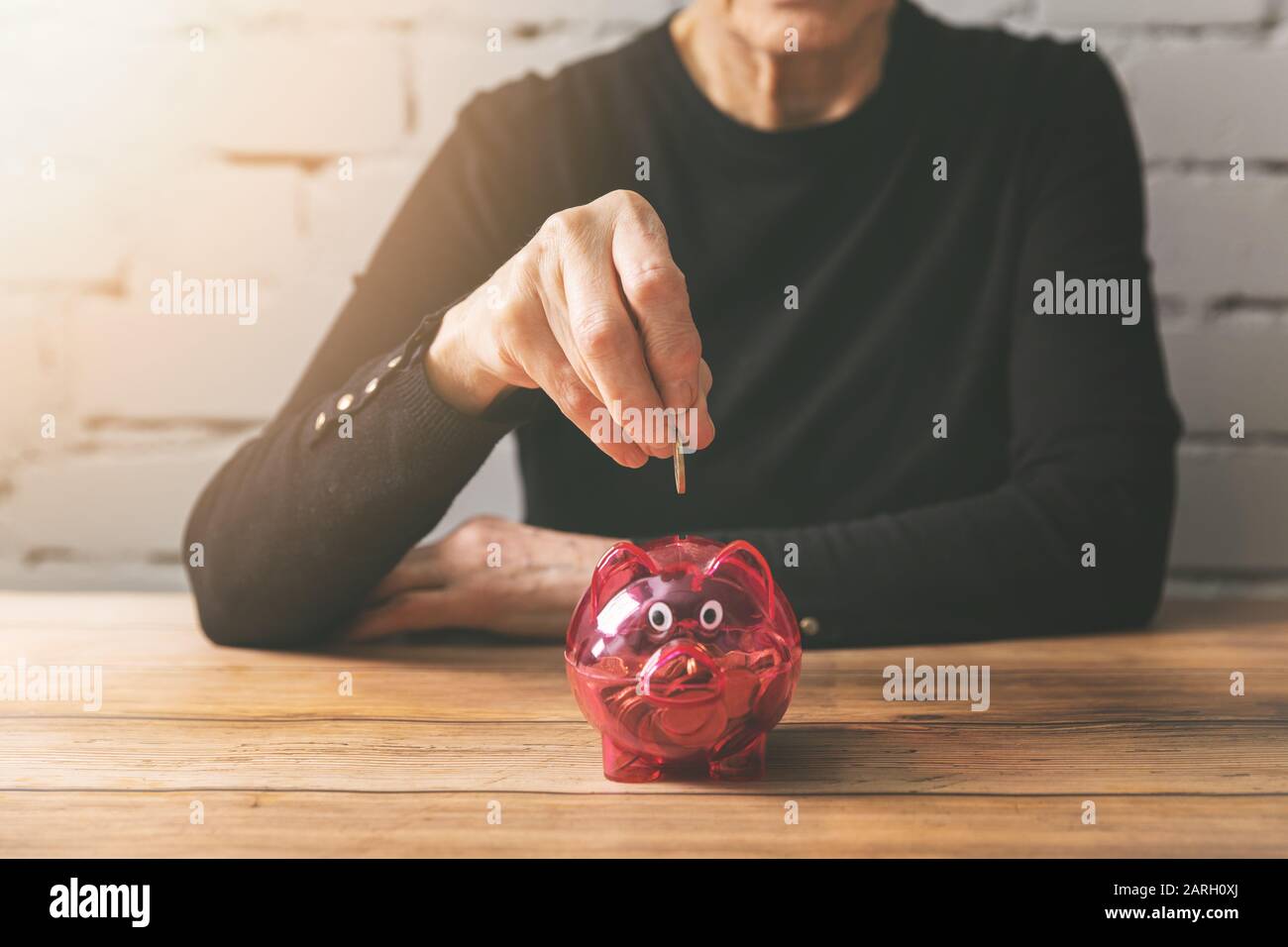 Money piggy bank woman hi-res stock photography and images - Alamy