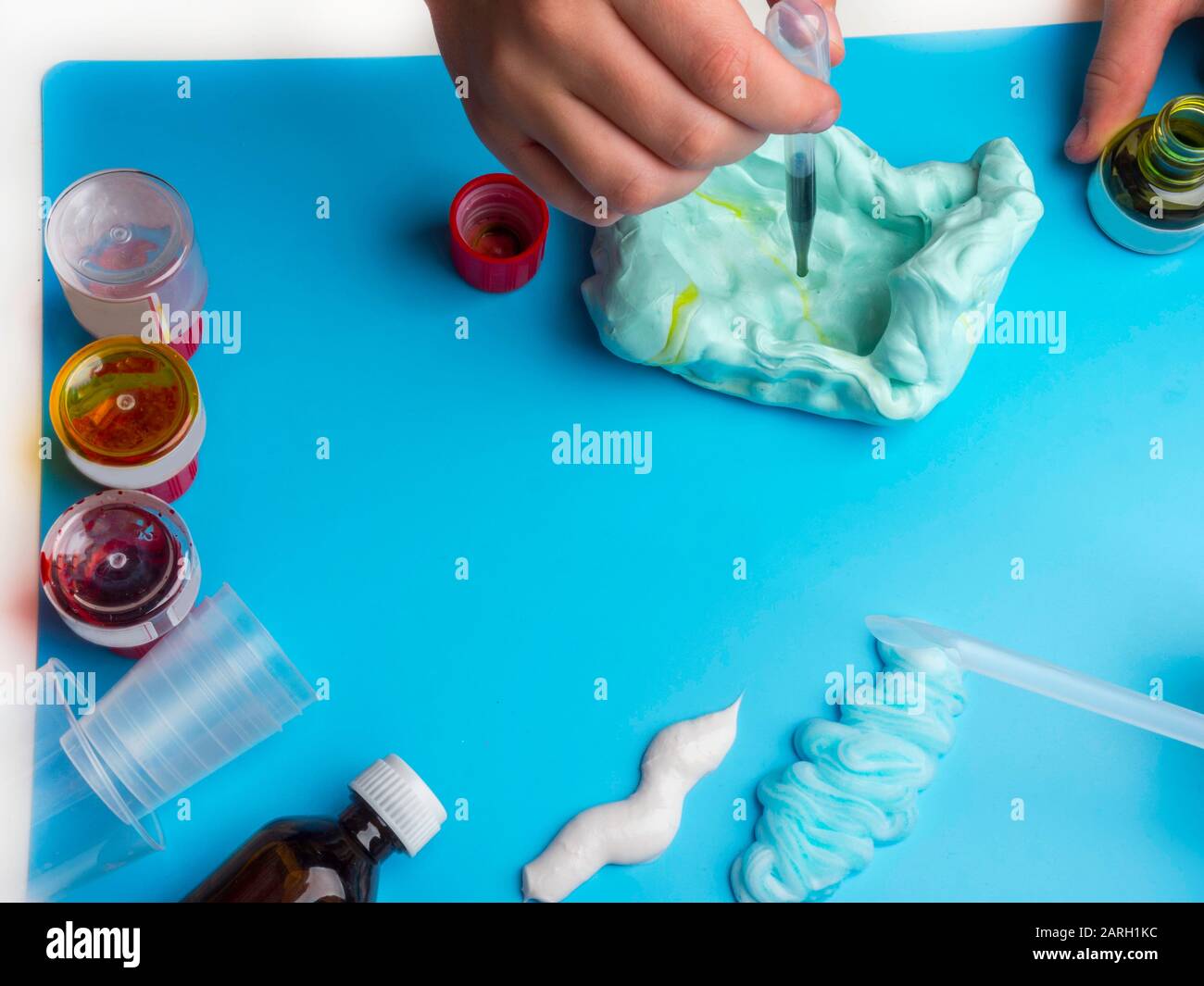 Components to make slime. Child education concept. On blue surface ...