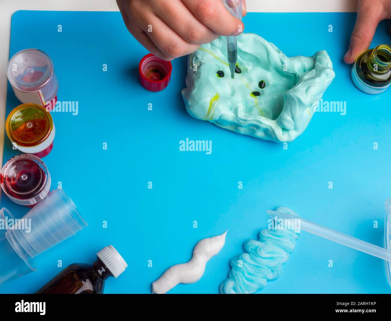 Components to make slime. Child education concept. On blue surface ...