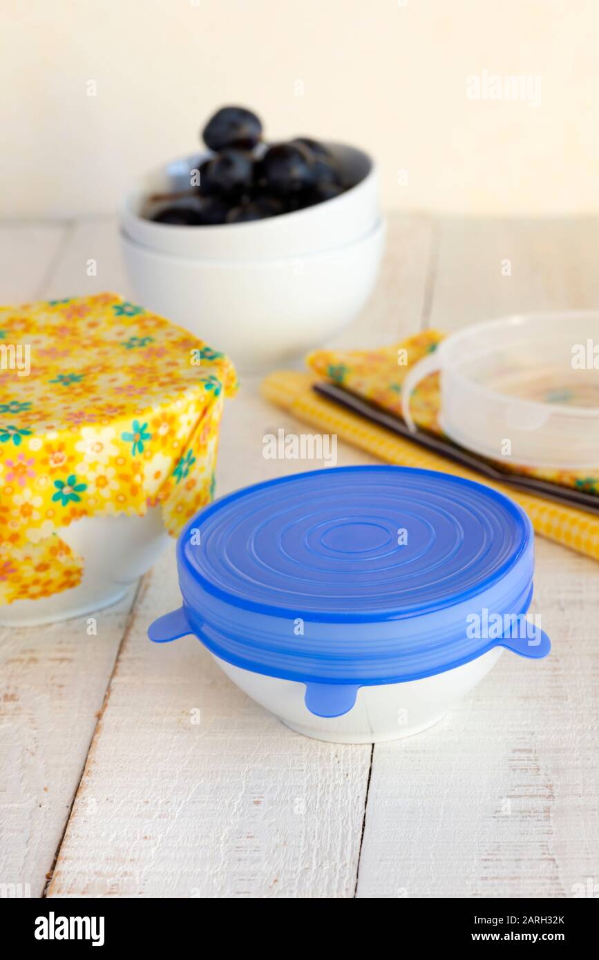 Bowls of food covered with a sustainable, re-usable silicone lid and beeswax wrap. Stock Photo