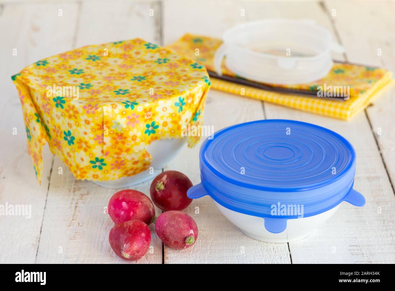 Bowls of food covered with a sustainable, re-usable silicone lid and beeswax wrap. Stock Photo