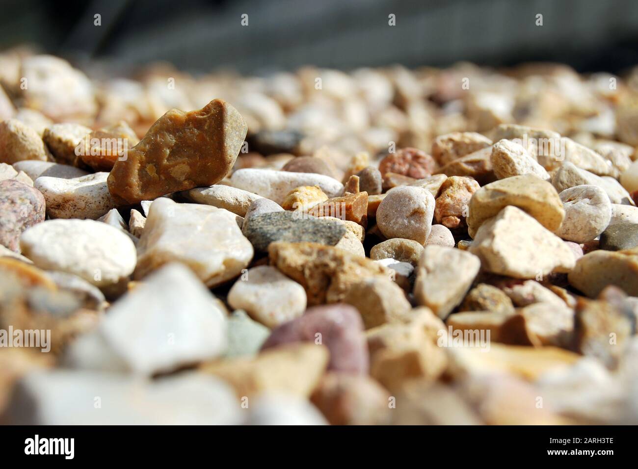 Small stones, gravel or pebbles close up from ow angle with perspective view Stock Photo