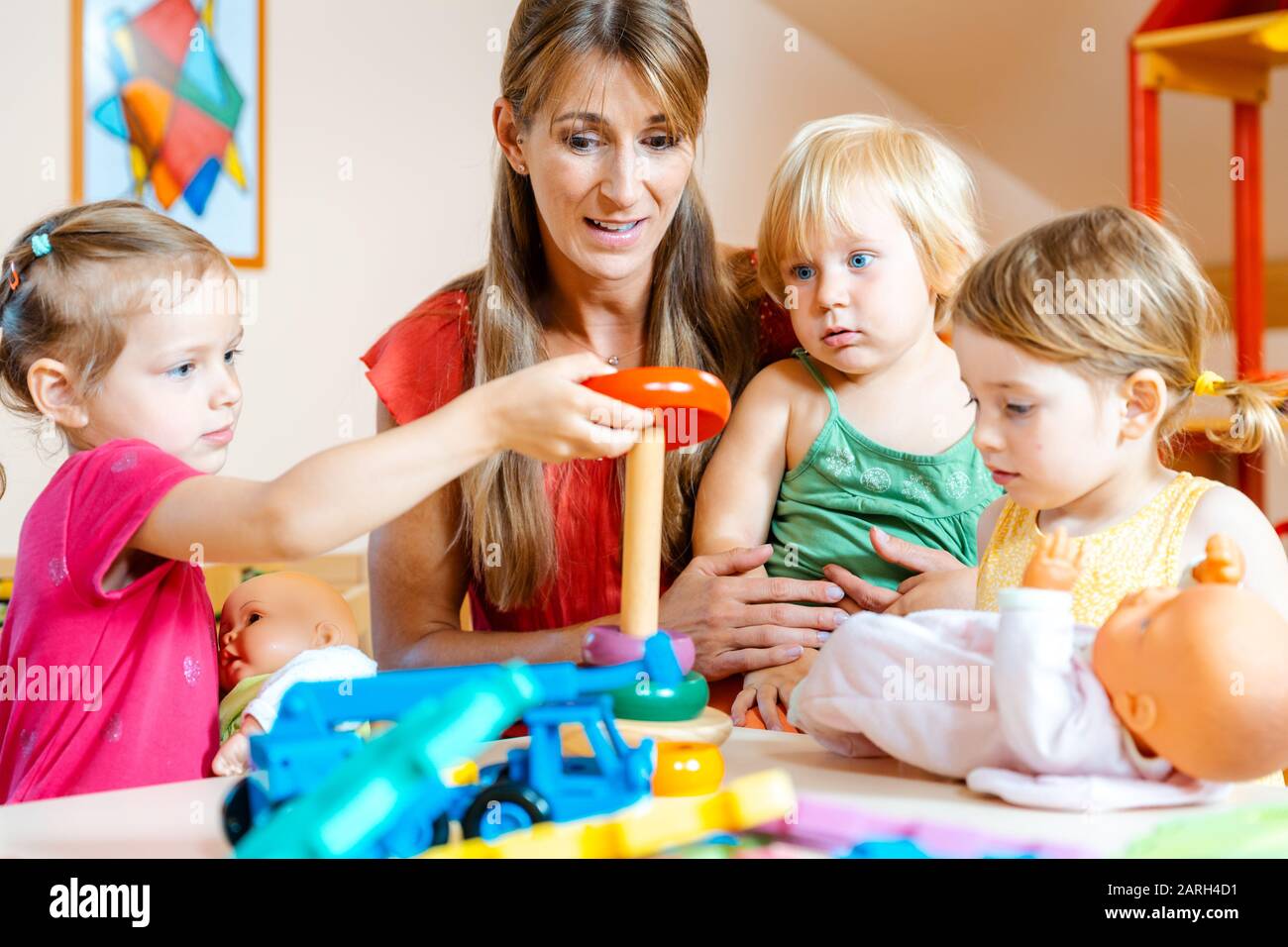 Children in nursery school learning and playing Stock Photo