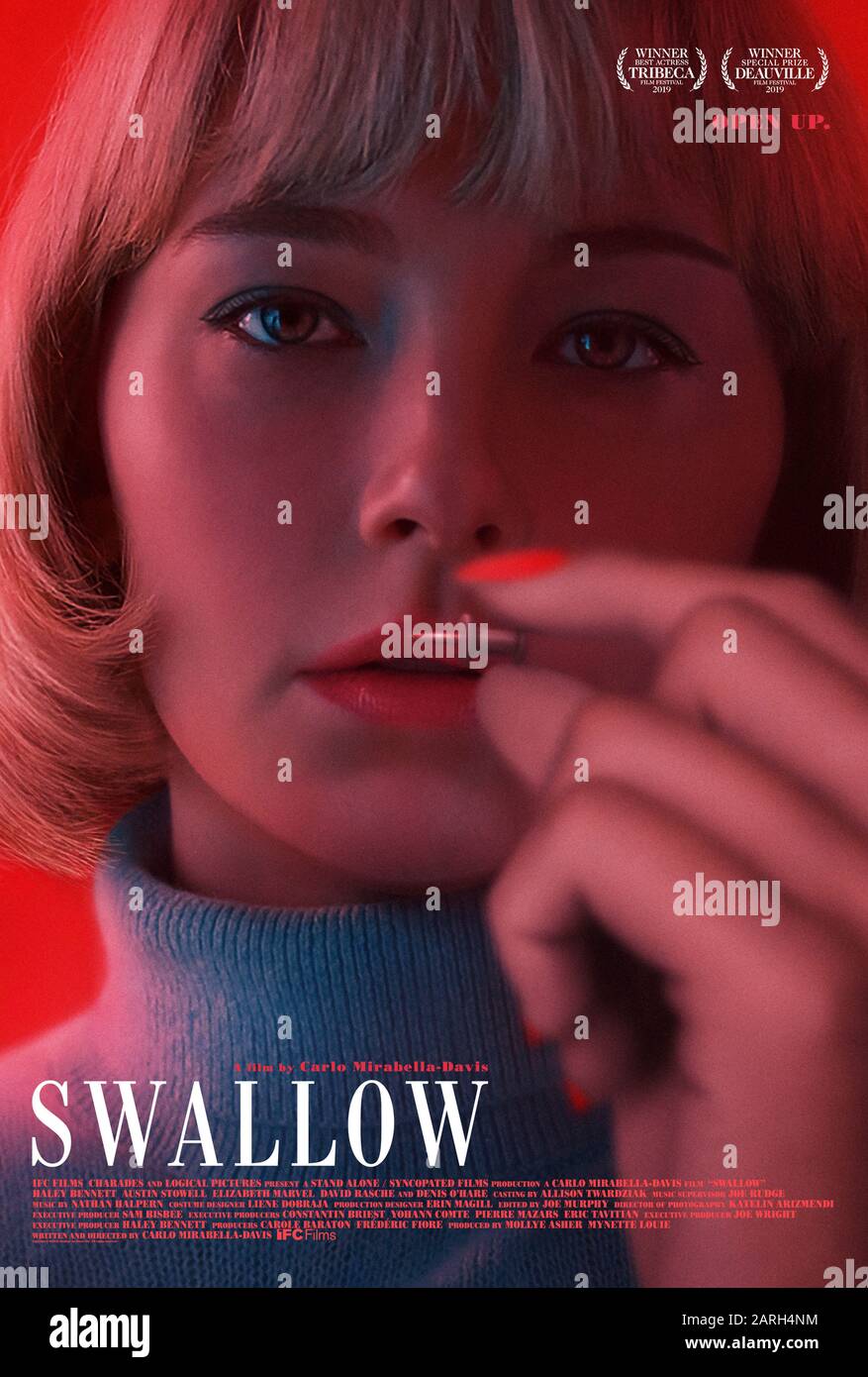 Swallow (2019) directed by Carlo Mirabella-Davis and starring Haley Bennett, Austin Stowell, Denis O'Hare and Elizabeth Marvel. Open up. A pregnant woman becomes compelled to swallow dangerous objects. Stock Photo