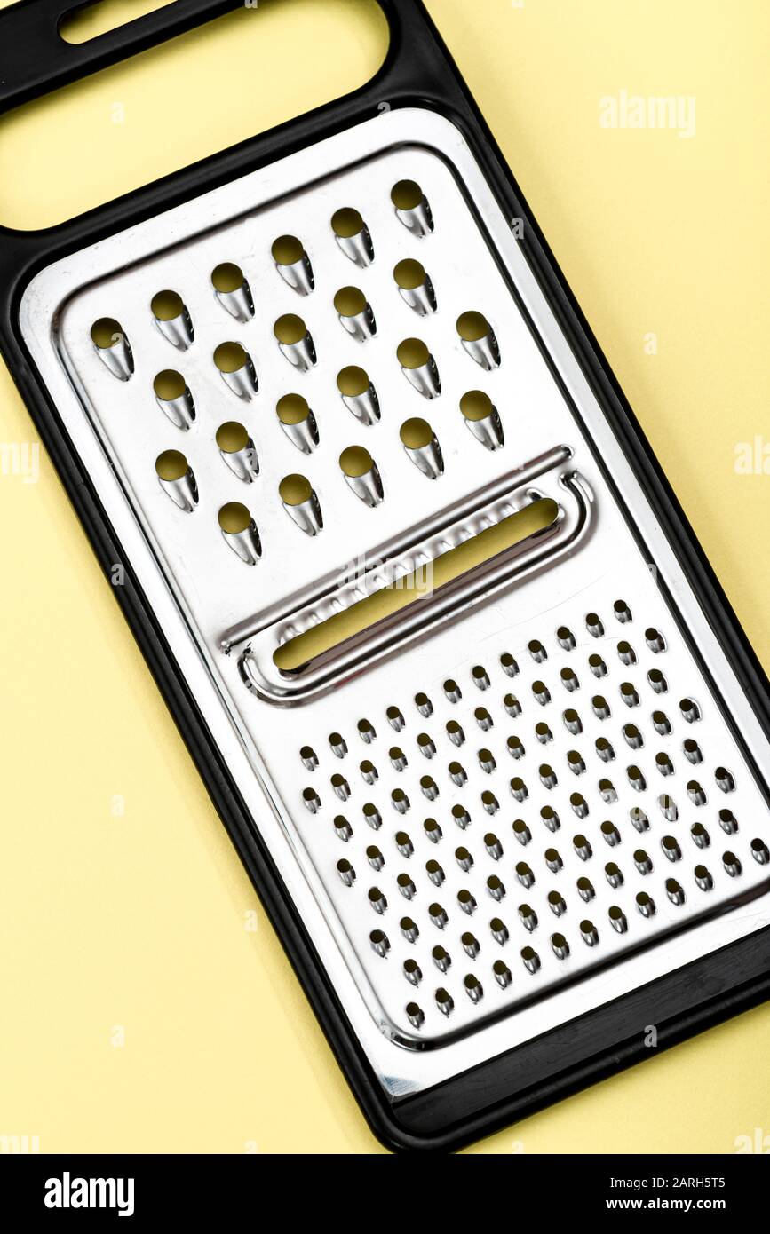 Stainless steel cheese grater. Stock Photo