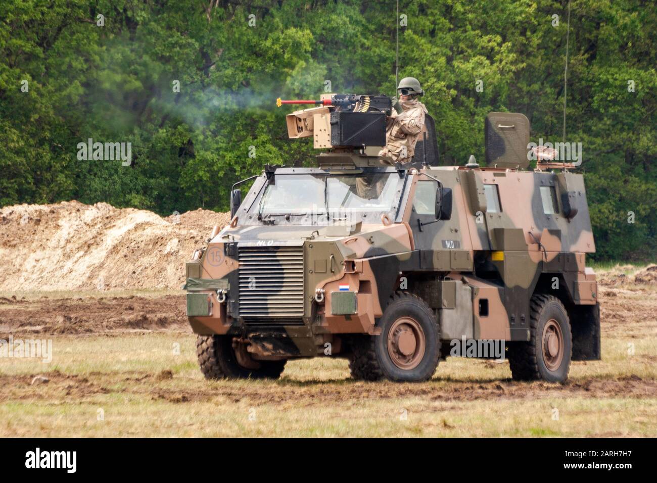 HAVELTE, NETHERLANDS - MAY 29, 2010: Soldier foring from a Dutch Army ...