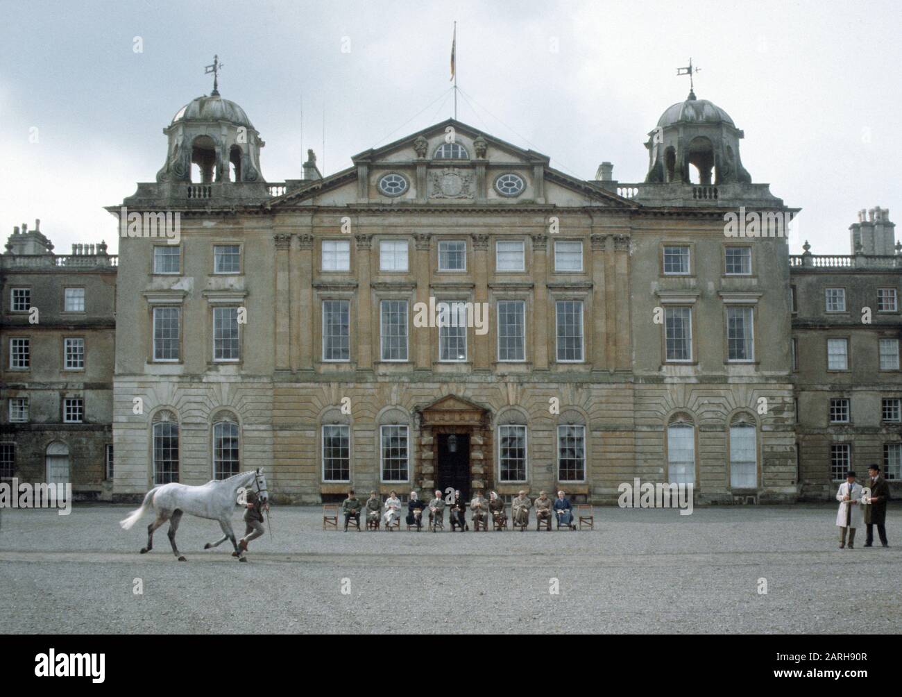 HM Queen Elizabeth II (4th from right) inspect the horses in front of Badminton House before the start of the Badminton Horse trials , England. Stock Photo
