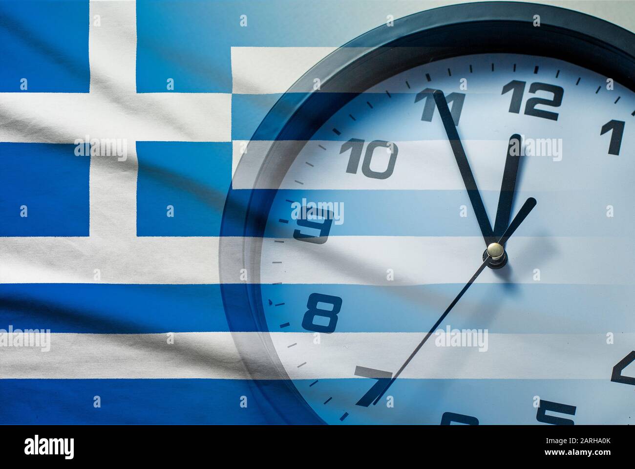 Greece flag with dial of a clock Stock Photo