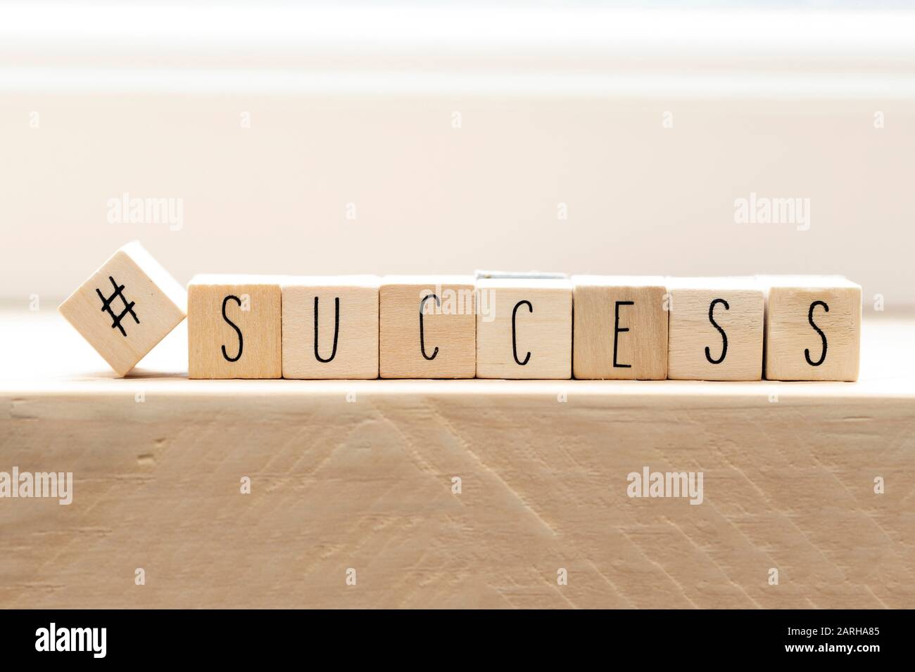Hashtag with succes written wooden cubes, social media concept Stock Photo