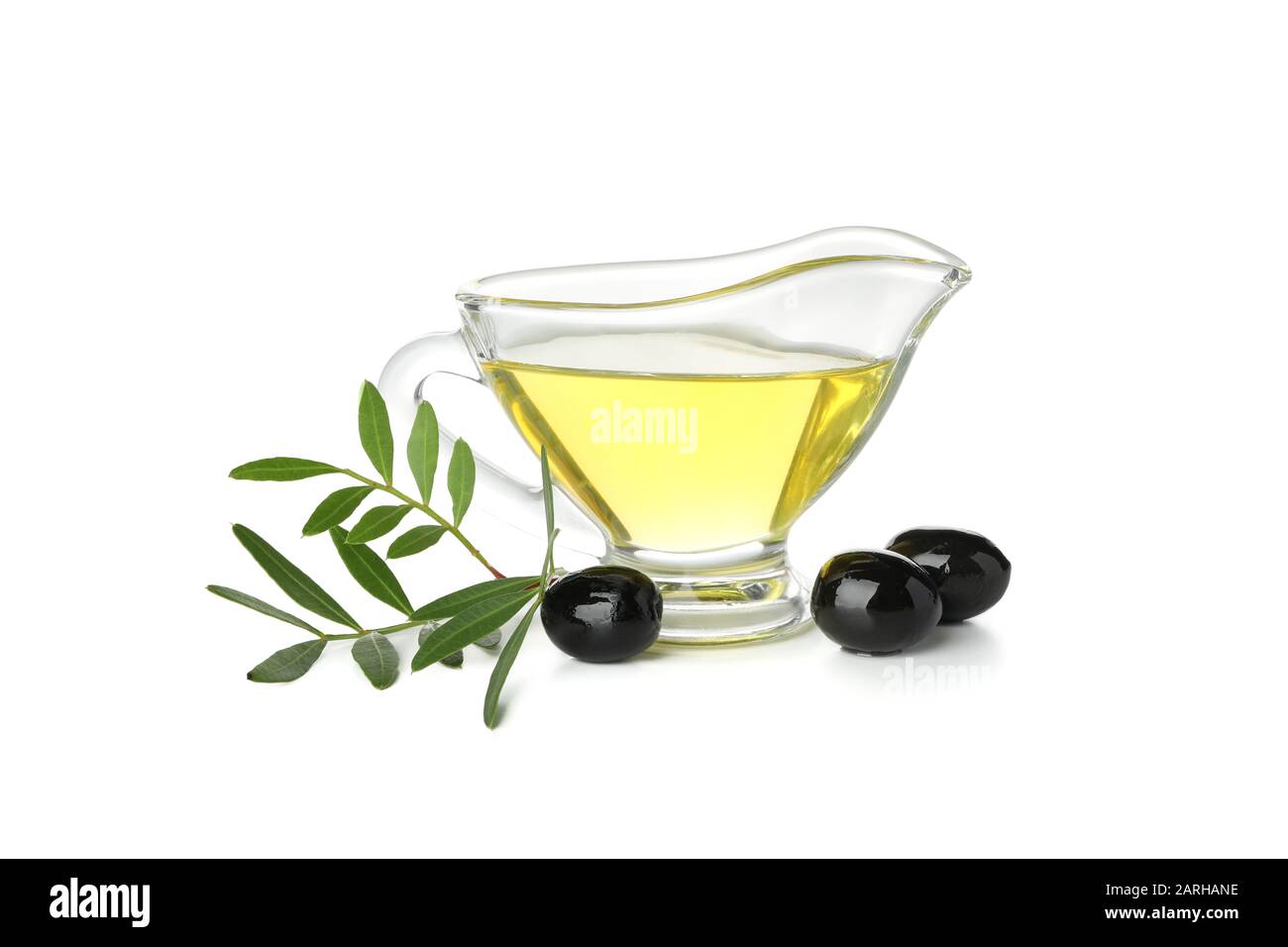 Gravy boat with olive oil, olives and leaves isolated on white