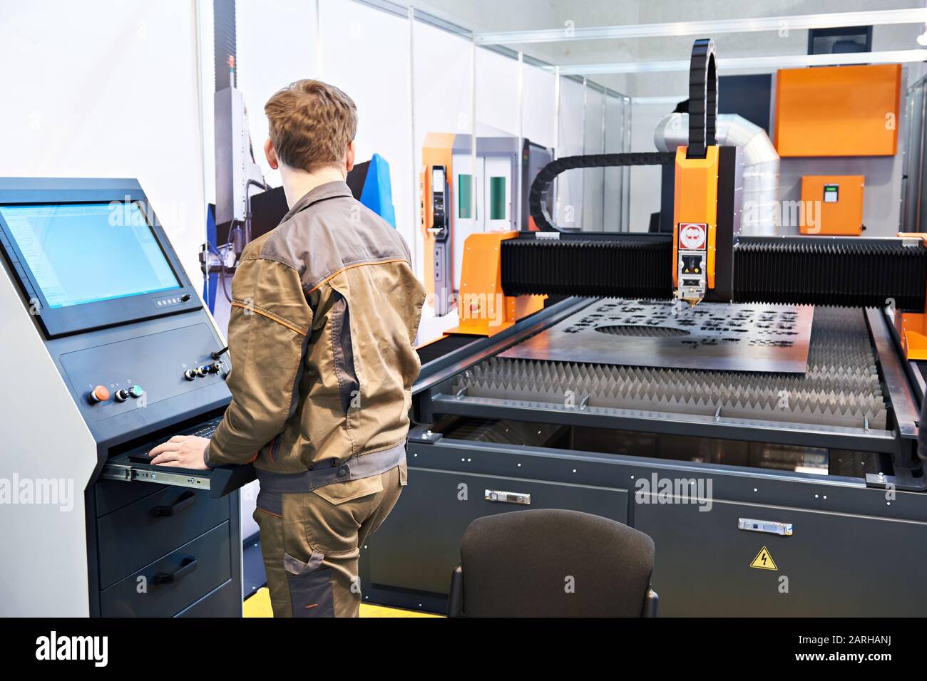 Worker operator laser cutting complex for metal Stock Photo Alamy