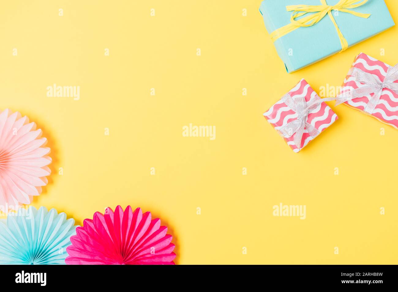 Flat Lay Composition Of Gift Boxes And Paper Party Decorations On