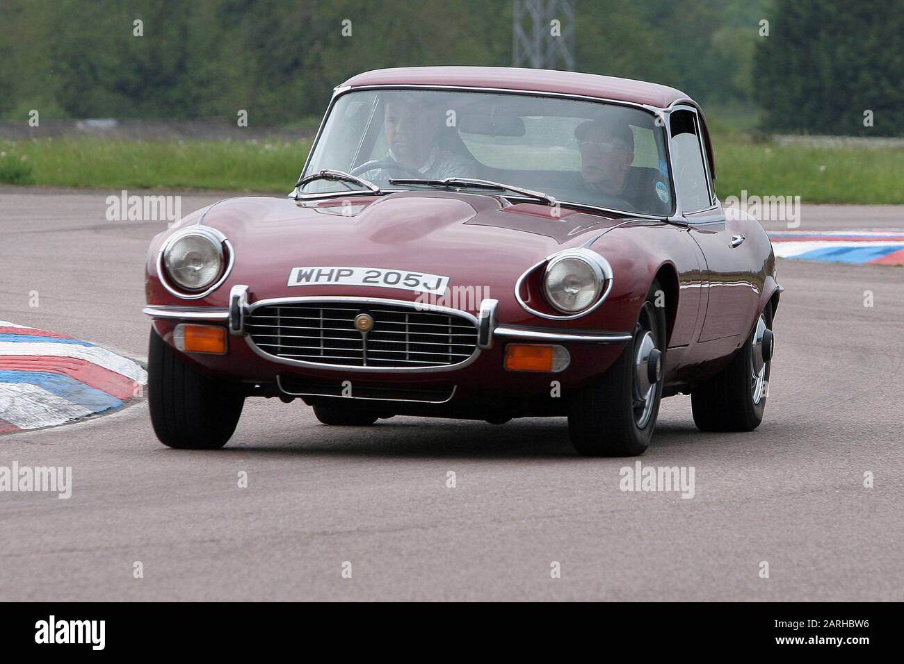 Early 1970s  Jaguar E Type Series 2  2+2  Coupe at Thruxton Circuit, Hampshire in 2006. Stock Photo