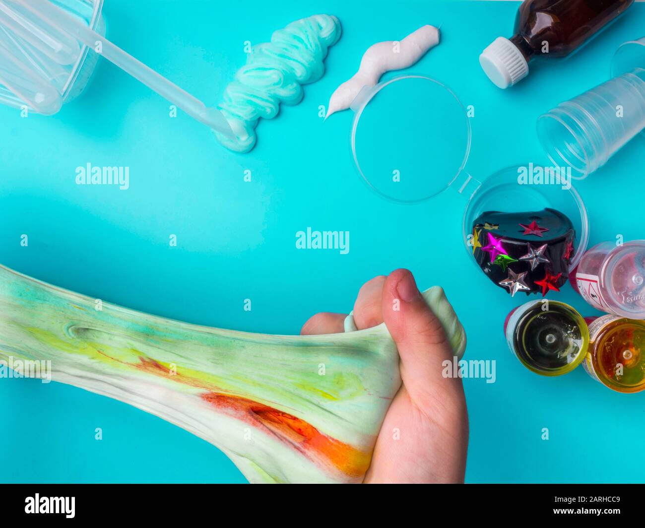 Components to make slime. Child education concept. On blue surface ...