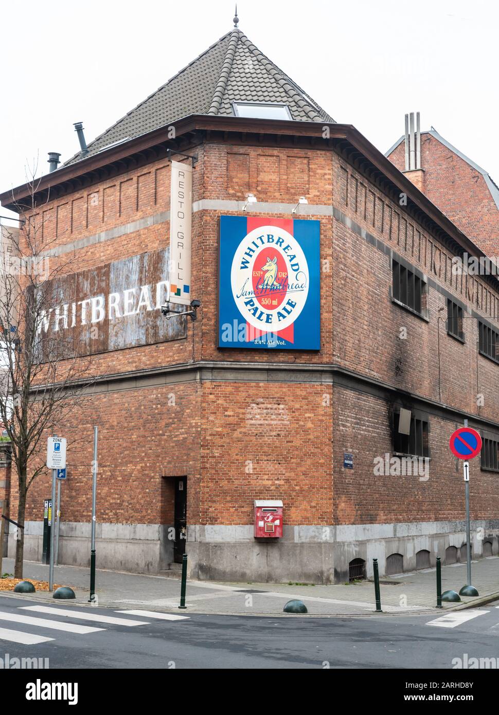Molenbeek, Brussels Capital Region / Belgium - 01 25 2020: Old Industrial building and publicity billboard of Whitbread pale ale beer Stock Photo