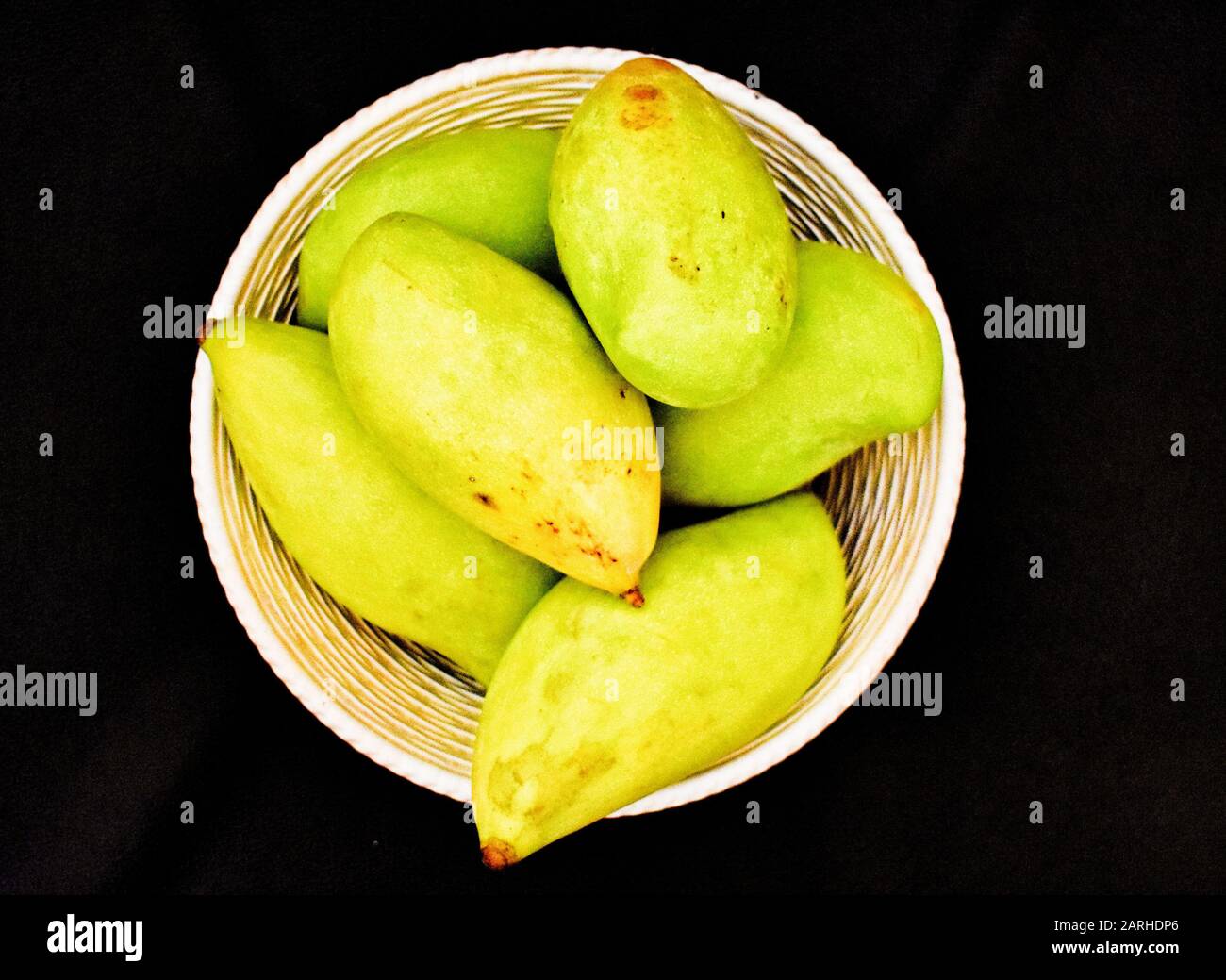 Green mangoes in a Basket Stock Photo Alamy