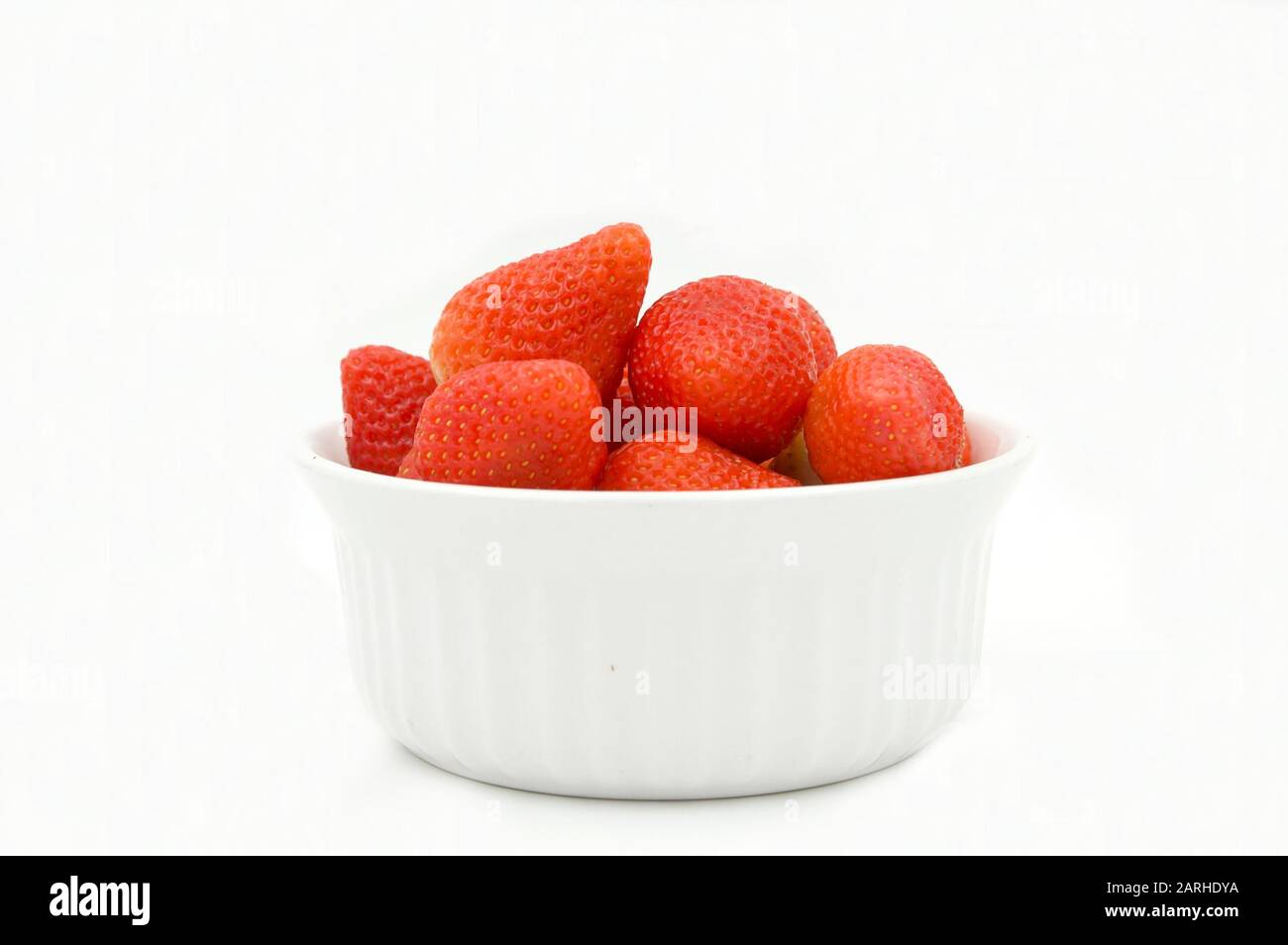 strawberries in a bowl isolated on white background Stock Photo - Alamy