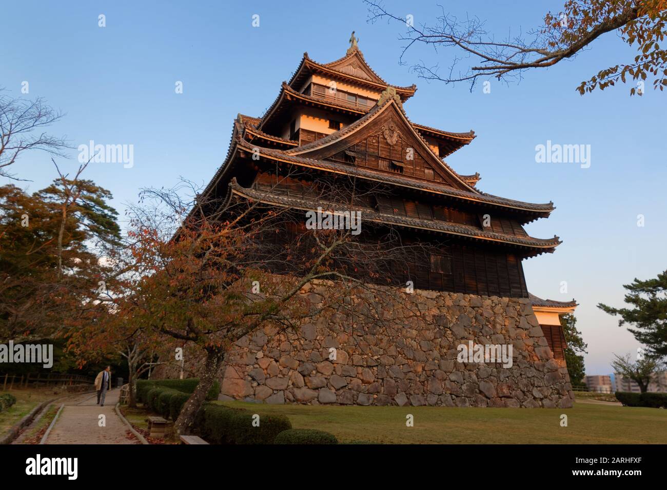 Matsue Castle, also called the black castle, at sunset. Matsue Castle is one of only a very few original castles in Japan. Stock Photo