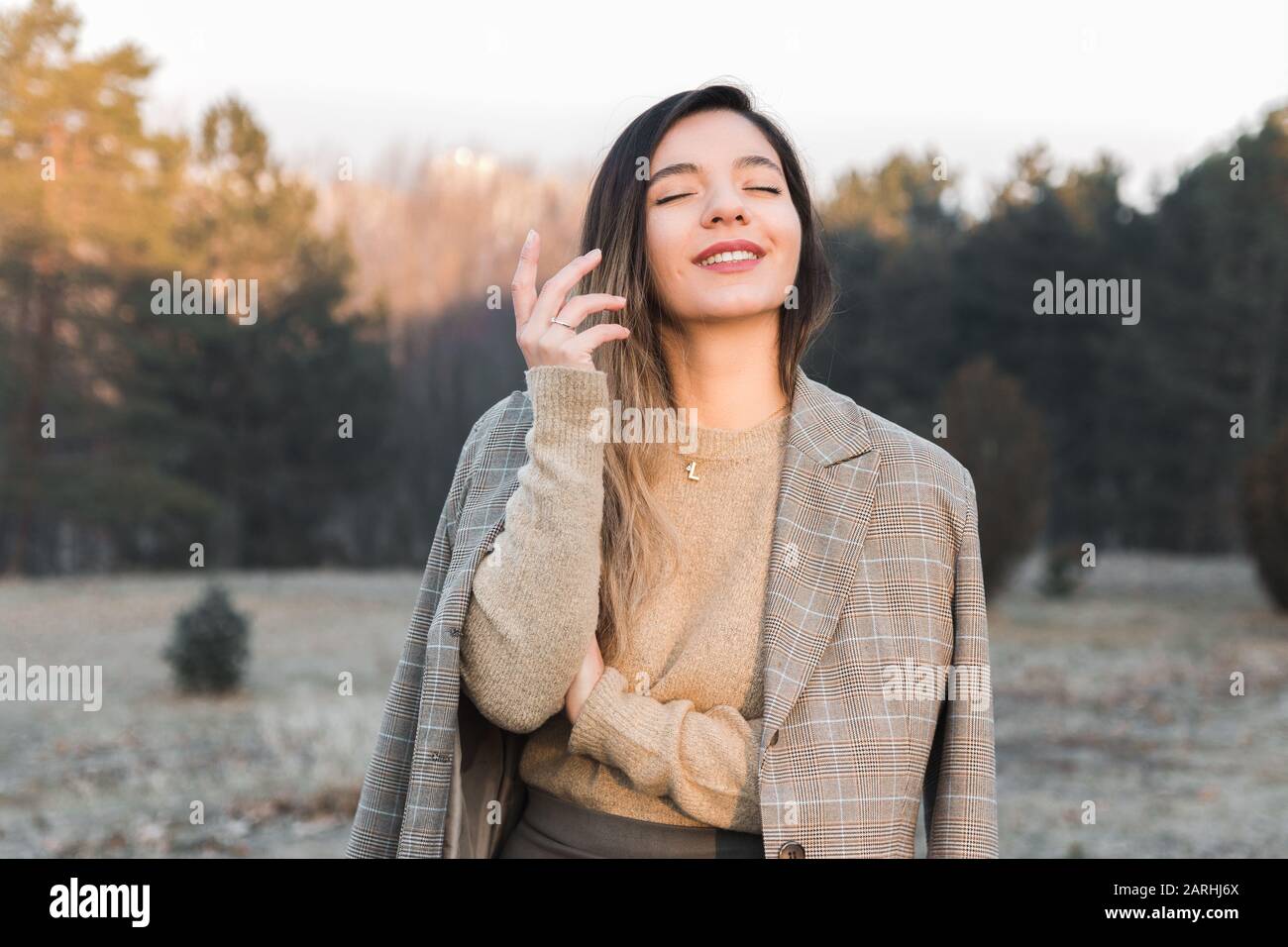 feminist movement. cheerful woman in casual clothes enjoying her existence out in nature Stock Photo
