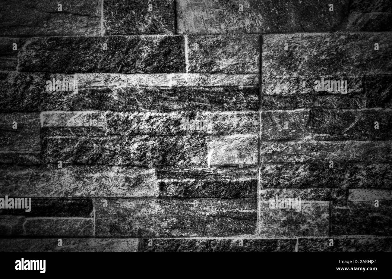 A background of stone wall in black and white close up view Stock Photo ...