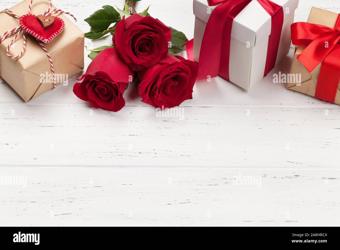 Valentines day greeting card with rose flowers and gift boxes on white ...
