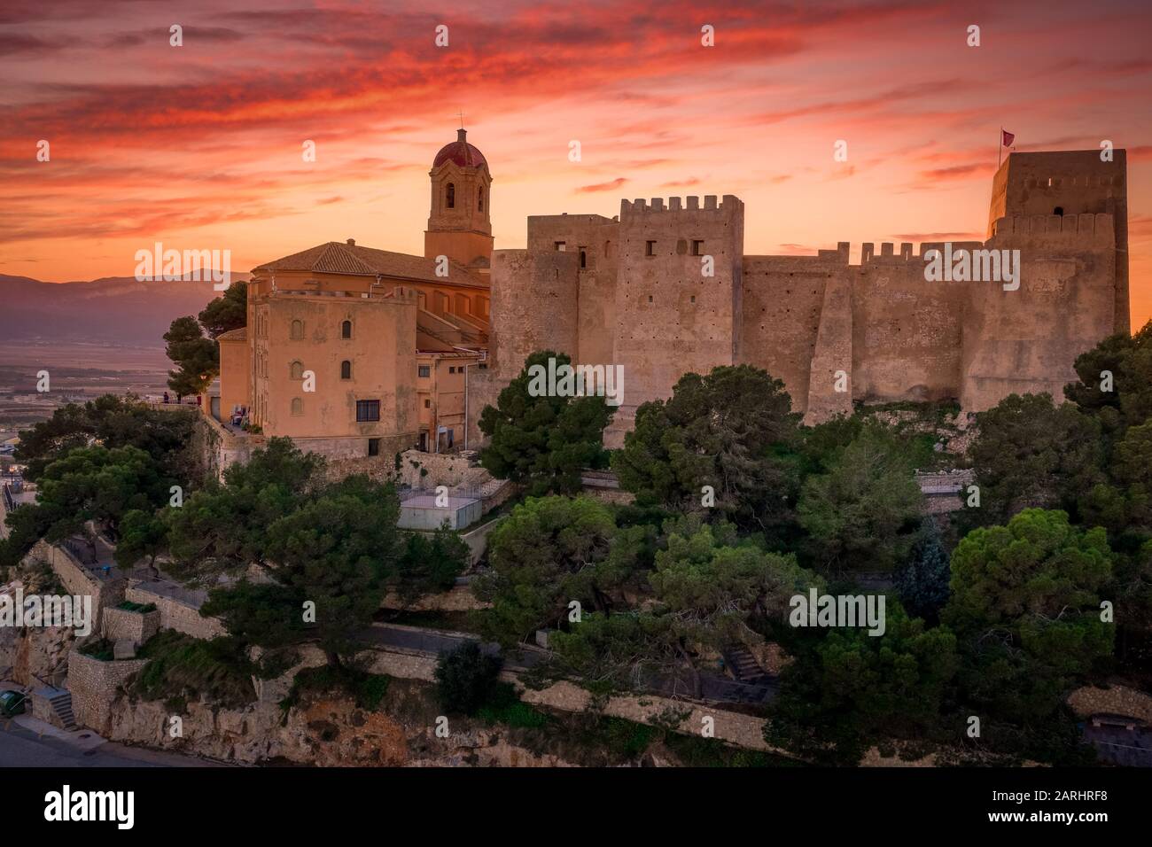 Aerial sunset panorama view of Cullera castle and popular seaside resort vacation town near Valencia Spain Stock Photo