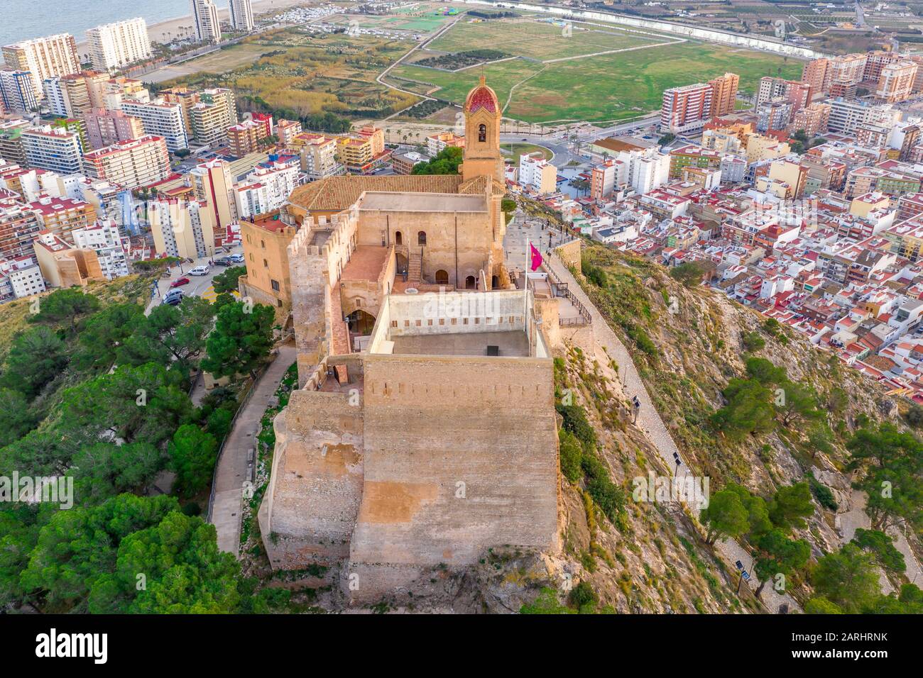 Aerial sunset panorama view of Cullera castle and popular seaside resort vacation town near Valencia Spain Stock Photo