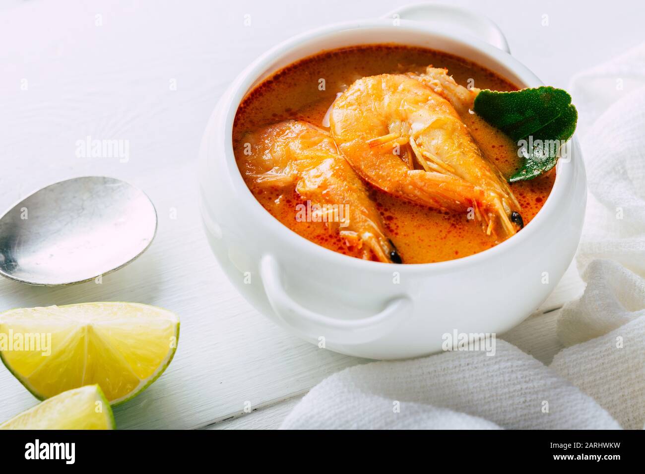 Tom yum with shrimp on a white plate, Traditional Thai food Stock Photo