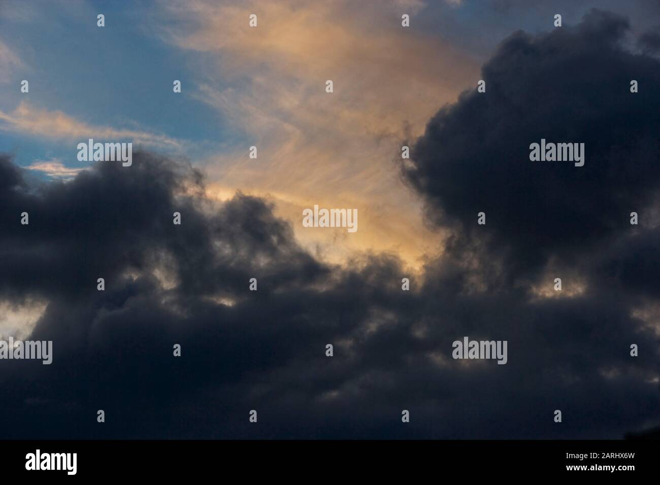 Beautiful evening clouds showing a clear blue sky overhead Stock Photo ...