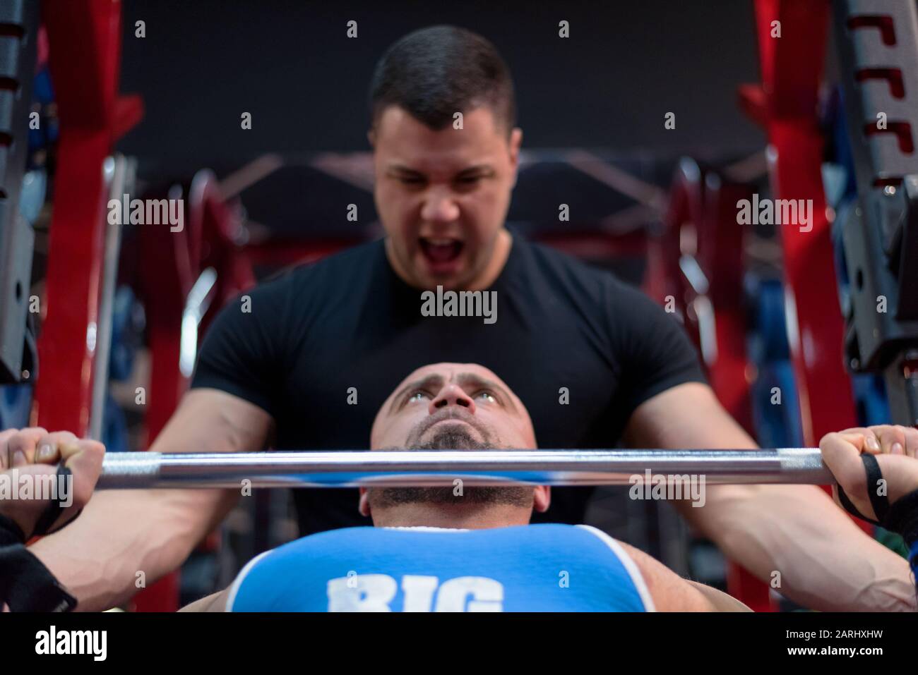 Bodybuilding Motivation. Two Bodybuilders Train Together at the Gym