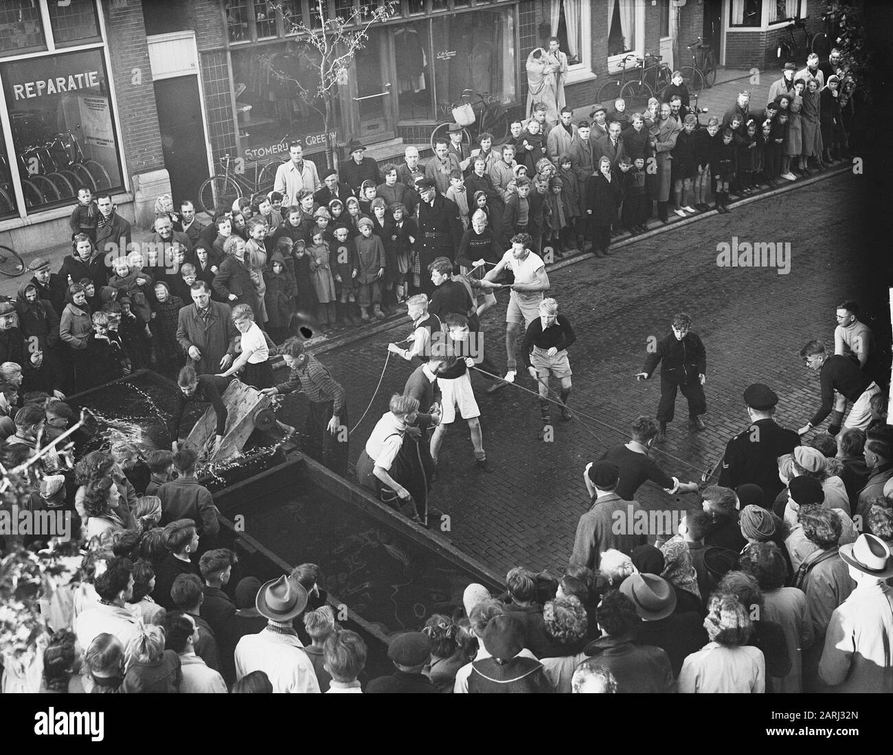 Carts driving on Luilak in Zaandam Date: May 12, 1951 Location: Noord-Holland, Zaandam, Zaanstad Keywords: holidays, youth Institution name: Luilak Stock Photo