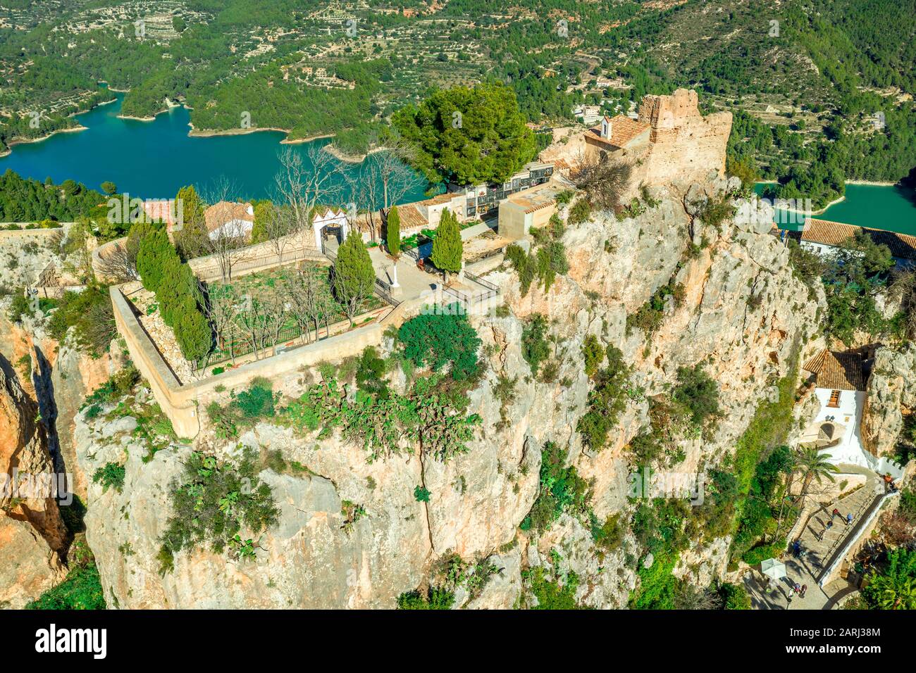 Panoramic view of popular Spanish vacation destination El Castell de Guadalest above a beautiful water reservoir with 2 castles and fortified enclave Stock Photo