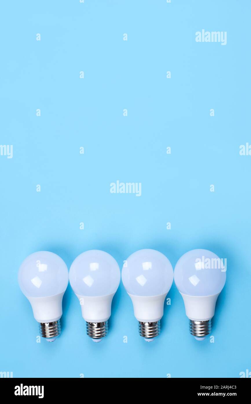 Several LED bulb on blue background. Saving energy concept Stock Photo ...