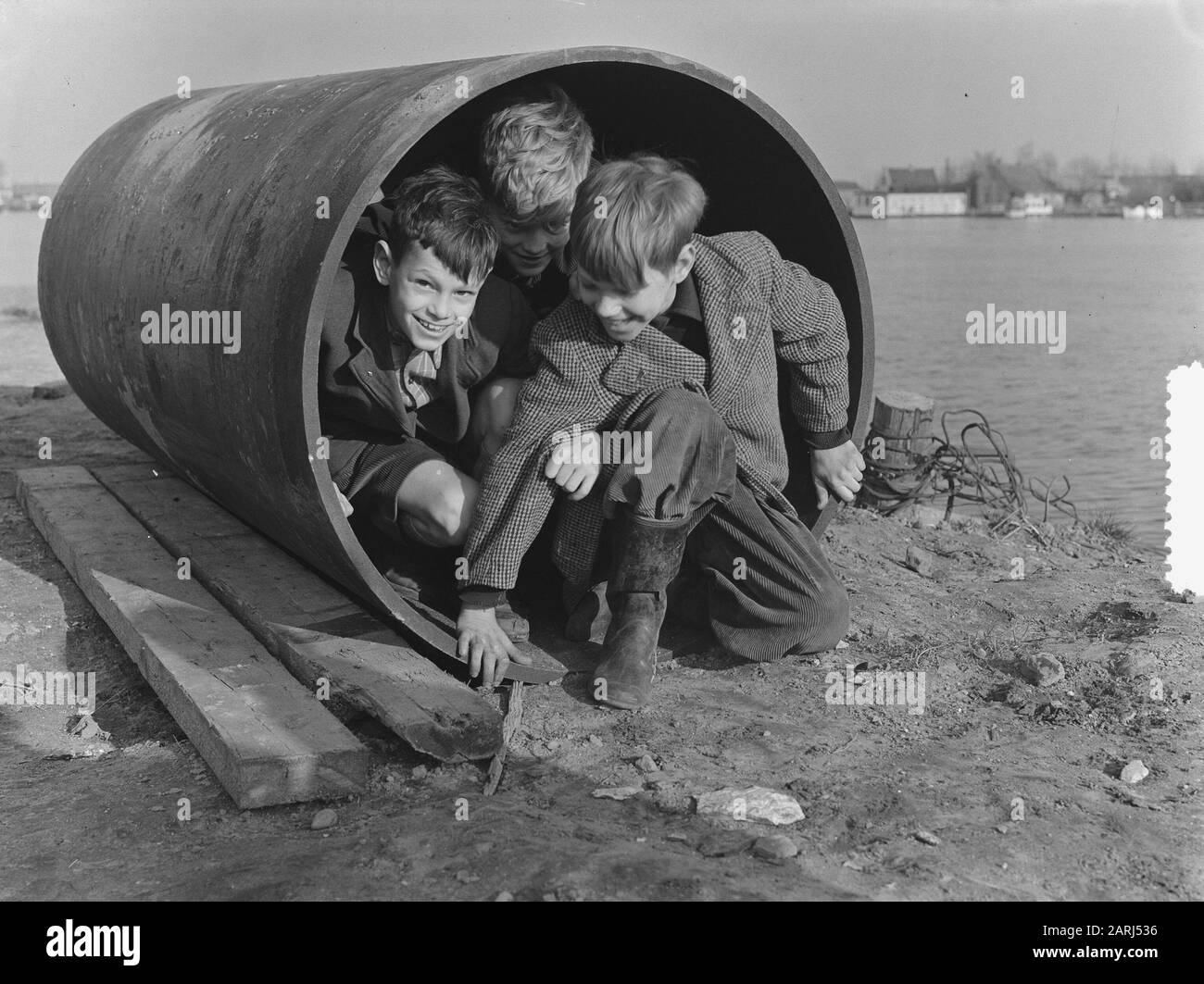 What do boys do with beautiful spring weather (on the construction site Date: February 26, 1952 Keywords: BOYS Stock Photo