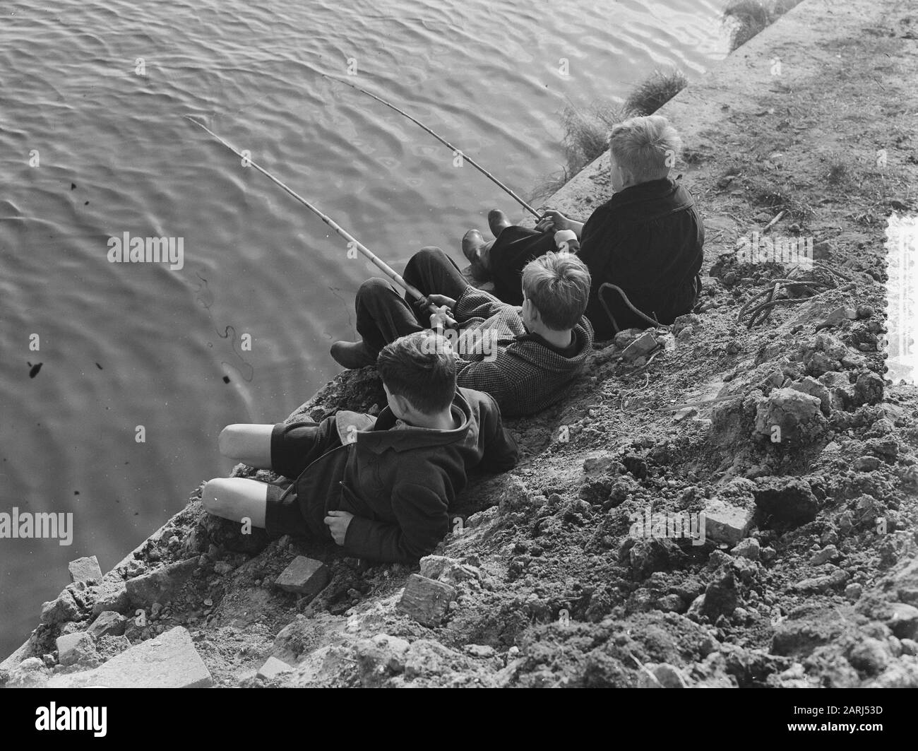 What do boys with beautiful spring weather (fish) Date: February 26, 1952 Keywords: BOYS, FISH Stock Photo