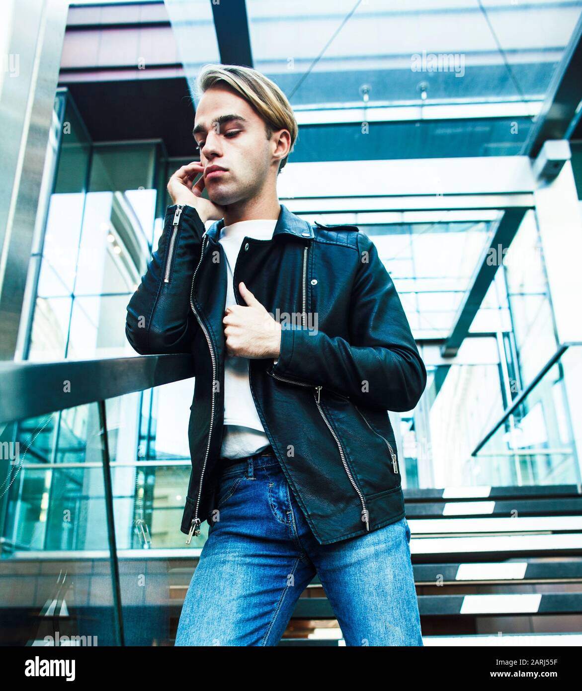 young modern hipster guy at new building university blond fashion handsome  boy, lifestyle people concept Stock Photo - Alamy