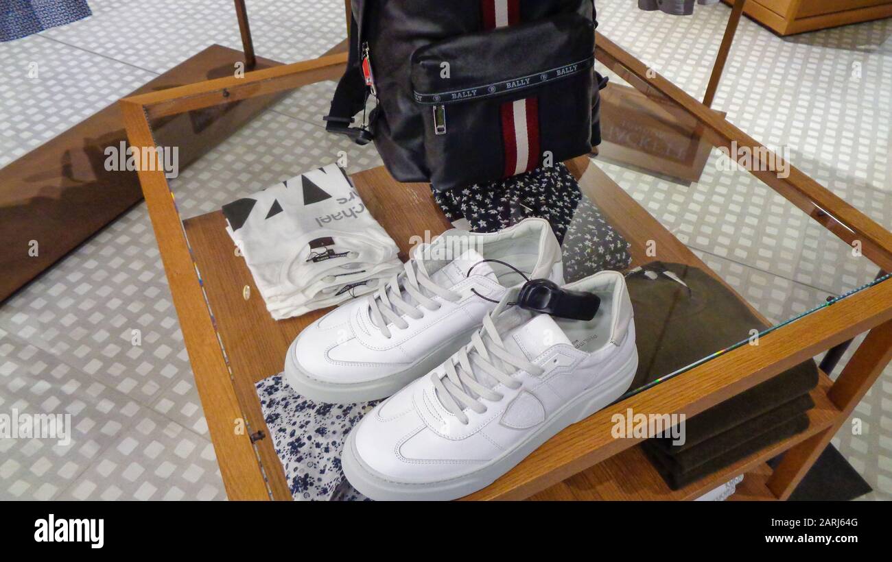 Luxury branded leather bags and shoes in famous shopping windows and