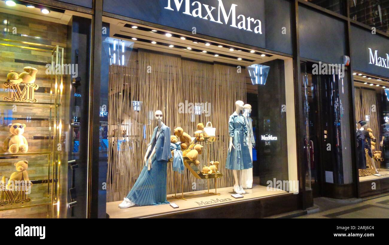 Luxury branded leather bags and shoes in famous shopping windows and