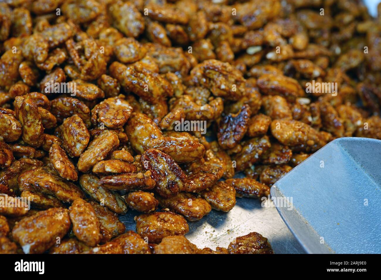 Honey roasted candied pecan nuts in bulk Stock Photo Alamy