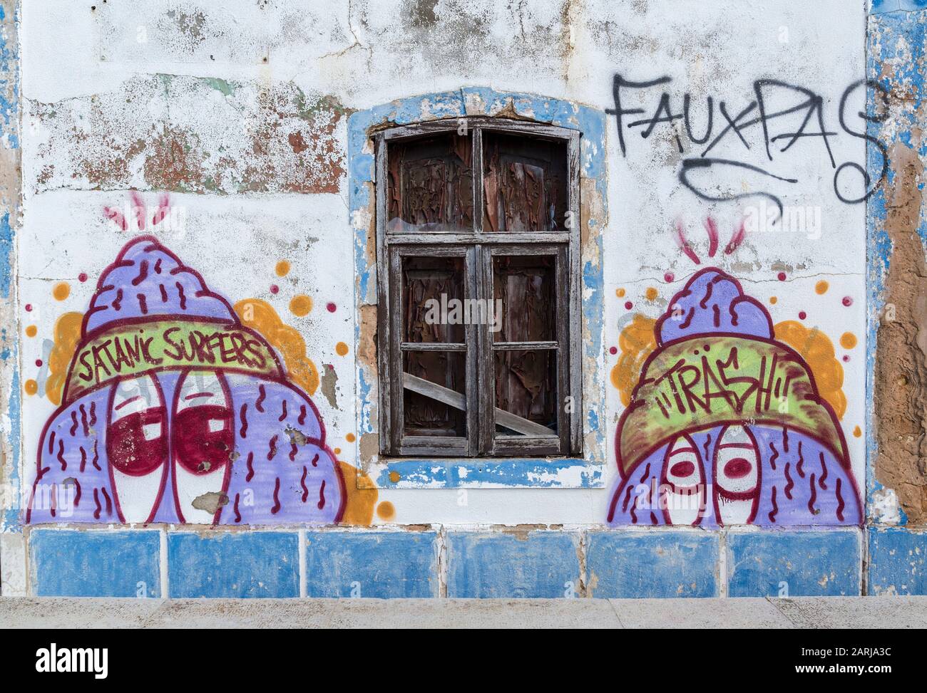 Graffiti on deserted building with title Satanic Surfers, Sagres, Algarve; Portugal Stock Photo
