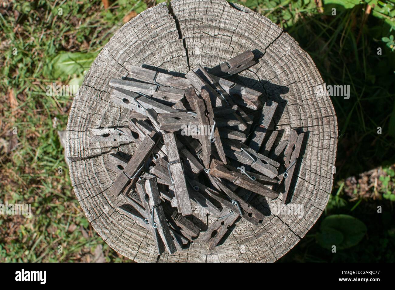 Pile of weathered wooden laundry clamps closeup Stock Photo