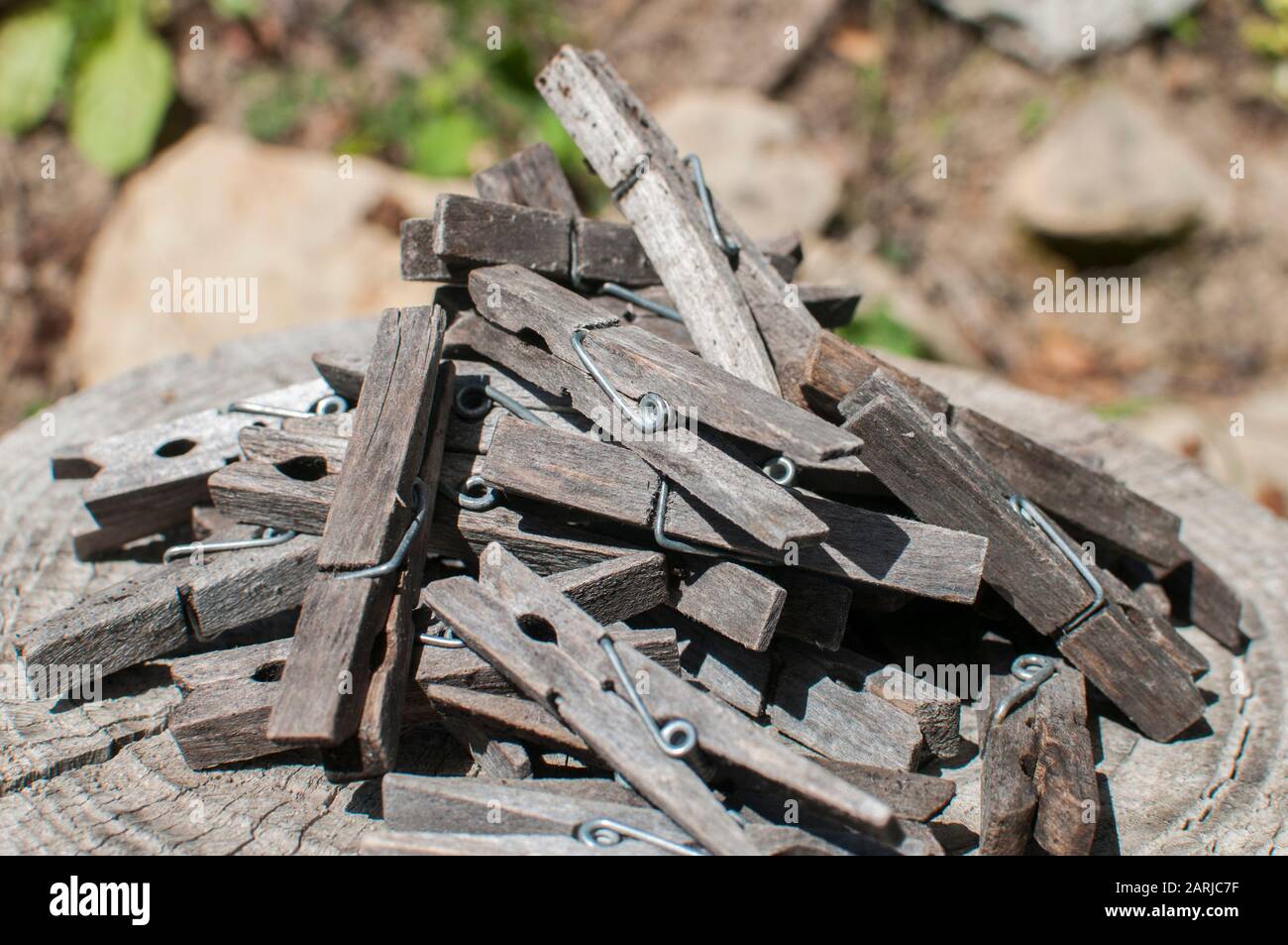 Pile of weathered wooden laundry clamps closeup Stock Photo